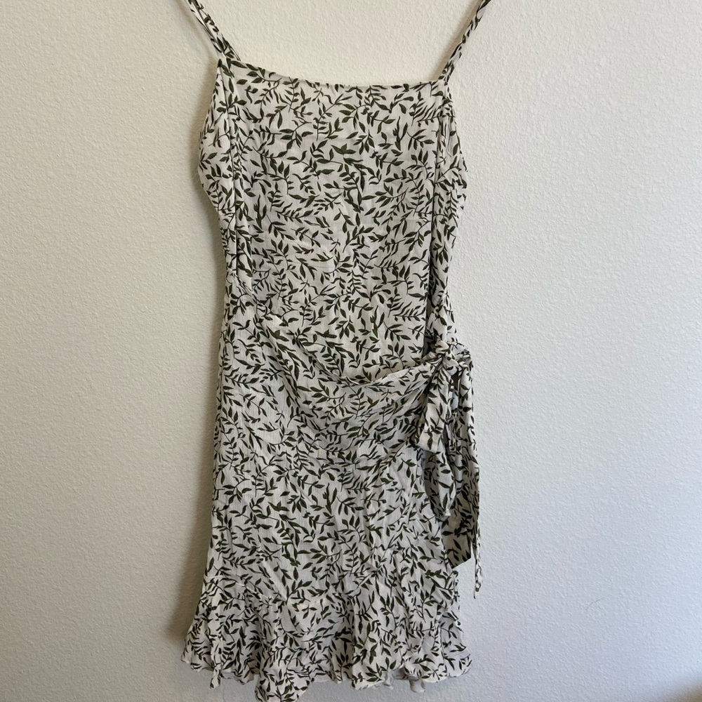 green and white printed wrap mini dress